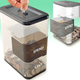 Illustration for article titled Trick Yourself Into Saving Money With the Spend/Save Coin Bank
